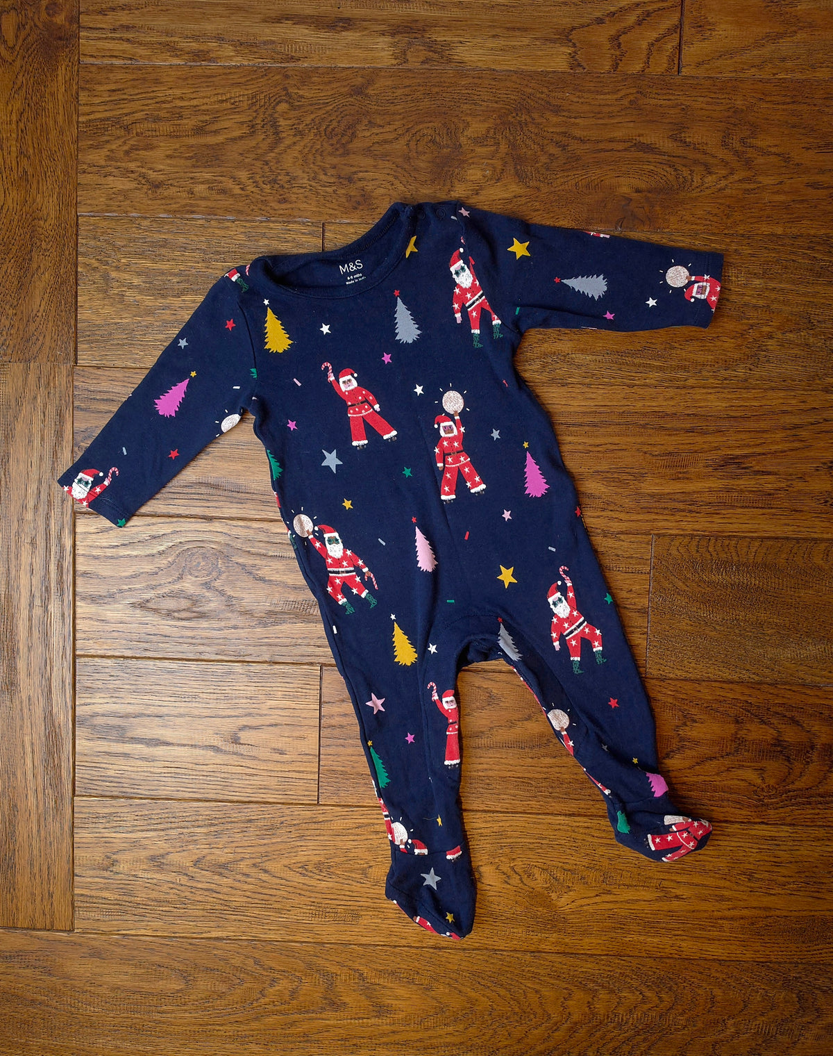Marks and Spencer Christmas Disco Santa Sleepsuit 6-9 Months.